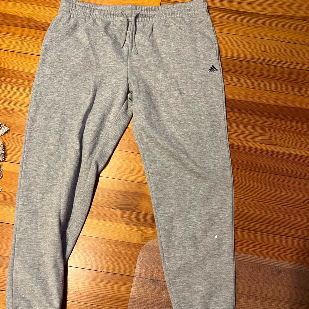 Grey adidas joggers.